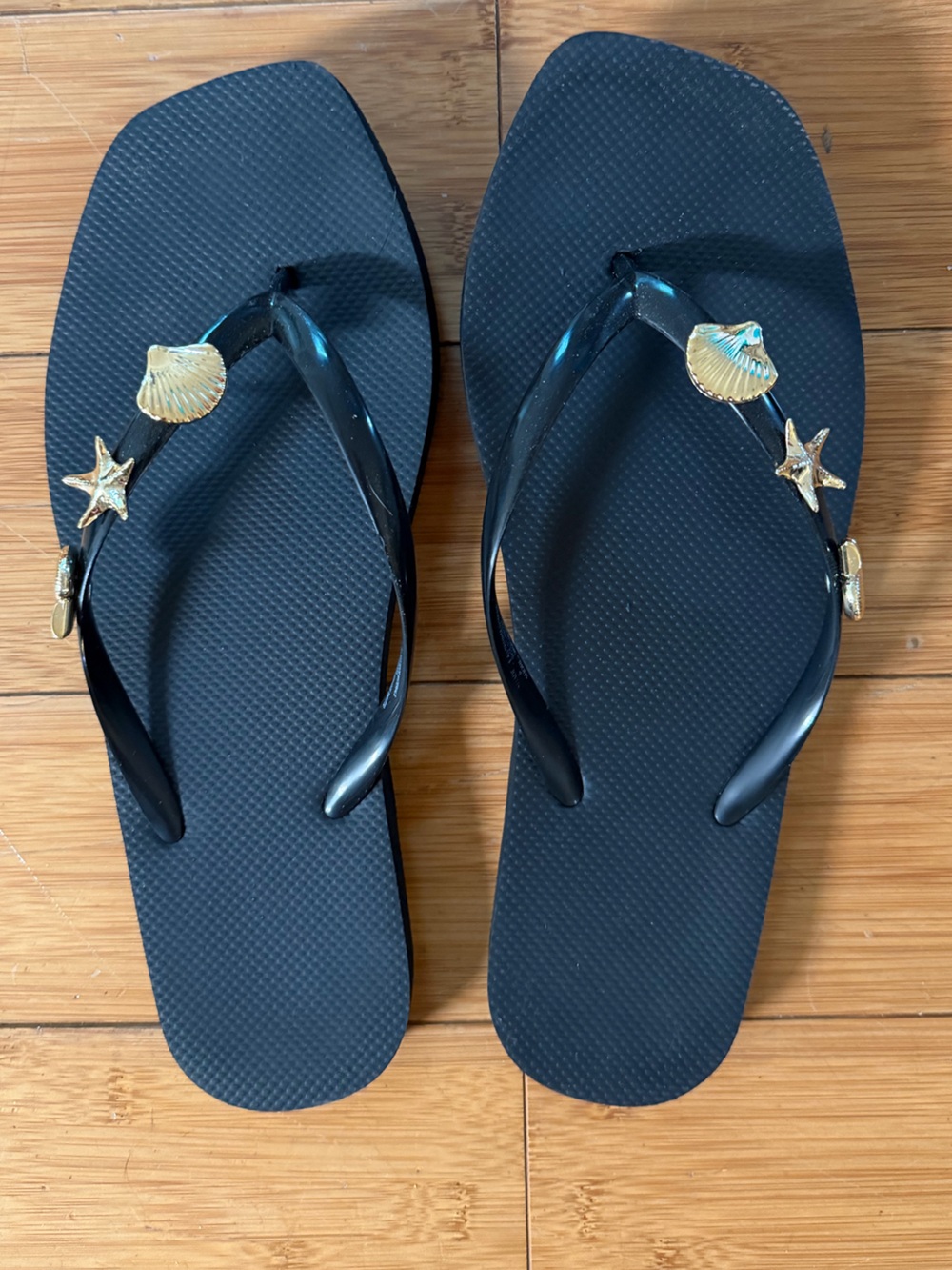 Women's black Flip Flop Sandals with Shell & Star Accents